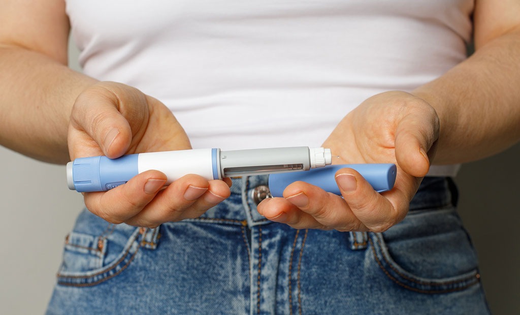 Woman holding weight loss injection