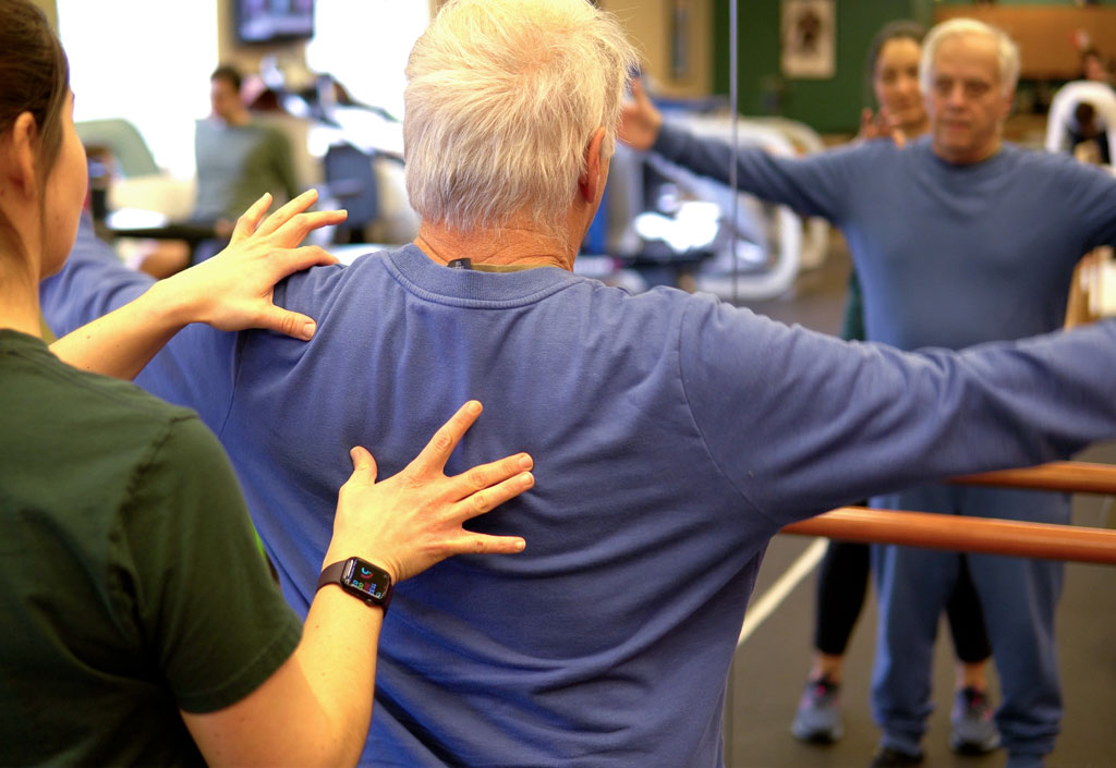 Older man doing physical therapy